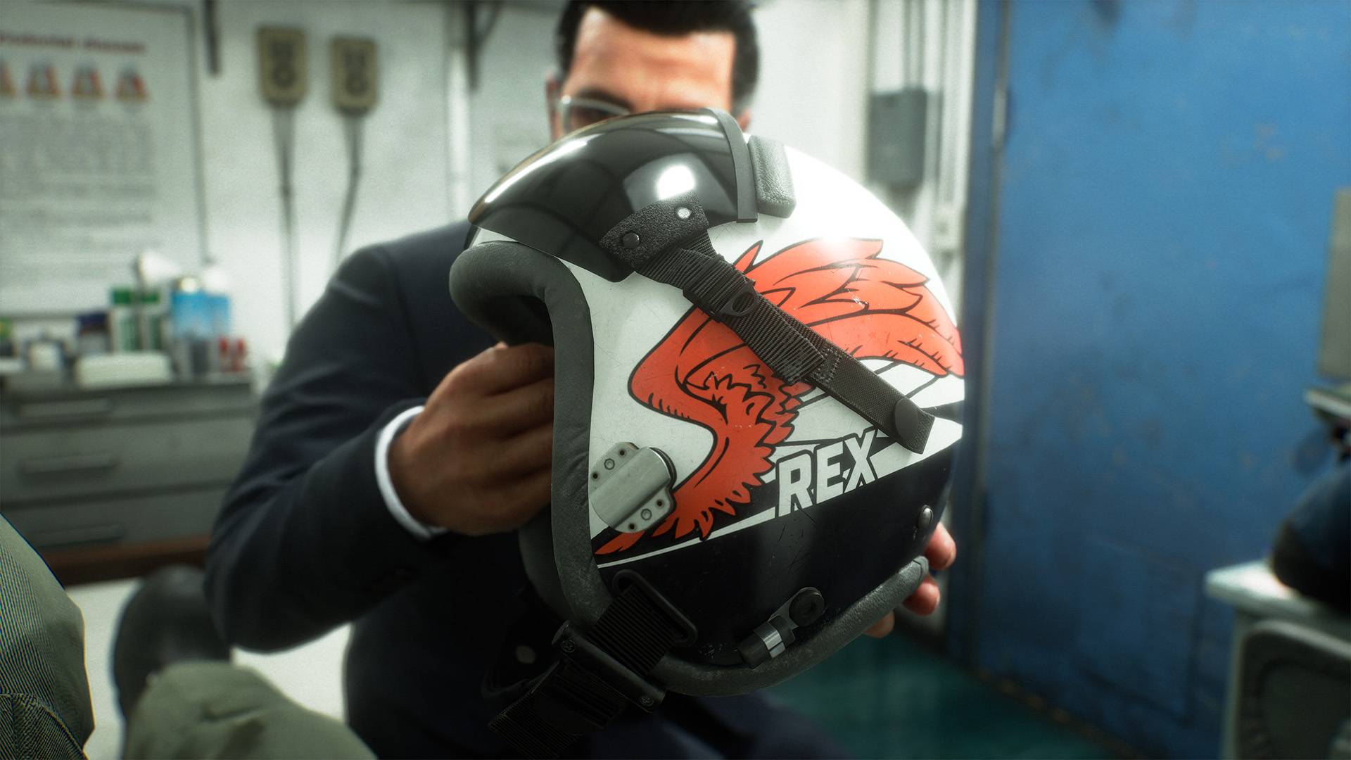 Ace Combat 8 in-game screenshot of character holding REX flight helmet with eagle emblem design