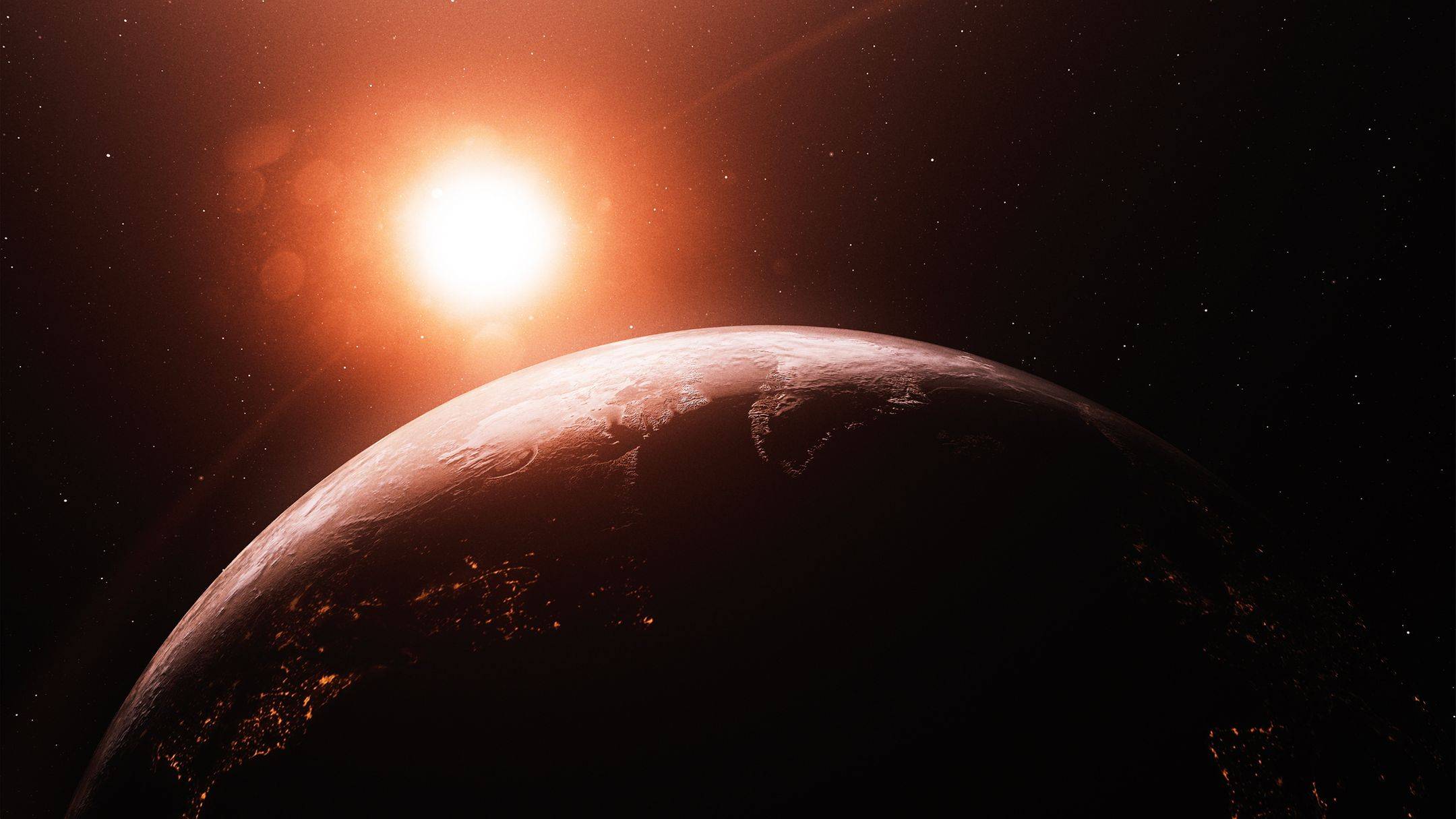 Una vista desde el espacio del sol ardiendo sobre una tierra humeante.